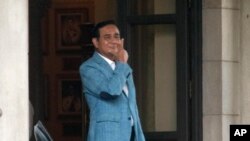Thai Prime Minister Prayuth Chan-ocha leaves the government house in Bangkok, Thailand, Friday, Feb. 8, 2019. (AP Photo/Sakchai Lalit)