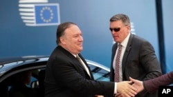 U.S. Secretary of State Mike Pompeo, left, arrives for a meeting with European foreign ministers at the Europa building in Brussels, May 13, 2019.