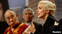 The Dalai Lama and singer Lady Gaga appear together for a question and answer session on "the global significance of building compassionate cities" at the U.S. Conference of Mayors 84th Annual Meeting in Indianapolis, Indiana United States, June 26, 2016.