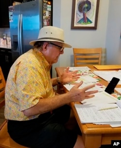 In this April 27, 2020 photo provided by Luckie, Ed Rosenblatt records audio for the "Radio Recliner" show at Somerby Sandy Springs, outside Atlanta. Rosenblatt is one of several retirees who have turned into DJs for the new online radio hour.