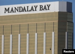 Two broken windows are seen at The Mandalay Bay Resort and Casino following a mass shooting at the Route 91 Festival in Las Vegas, Nevada, Oct. 2, 2017.