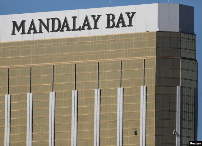 Two broken windows are seen at The Mandalay Bay Resort and Casino following a mass shooting at the Route 91 Festival in Las Vegas, Nevada, Oct. 2, 2017.