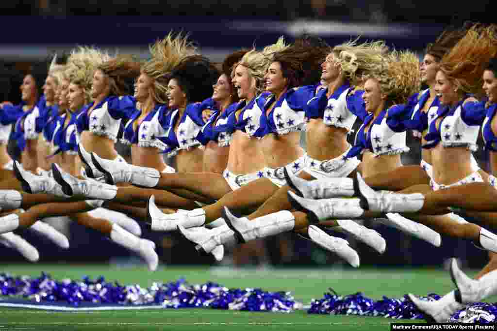 Dallas Cowboys cheerleaders perform prior to the game against the Houston Texans at AT&T Stadium in Arlington, Texas, Aug. 24, 2019.