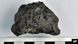 Image of the 58 g Tissint specimen from the University of Alberta Meteorite Collection.