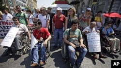 Protesters participate in a rally against the government's latest austerity measures and plans to sell off state enterprises in central Athens, June 18, 2011