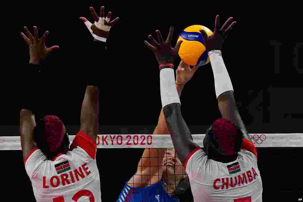 Kenya&#39;s Lorine Chebet Kaei, left, Kenya&#39;s Sharon Chepchumba Kiprono, right, and Serbia&#39;s Bojana Milenkovic challenge for the ball during the women&#39;s volleyball preliminary round pool A match between Serbia and Kenya at the 2020 Summer Olympics, Thursday, July 29, 2021, in Tokyo, Japan. (AP Photo/Frank Augstein)