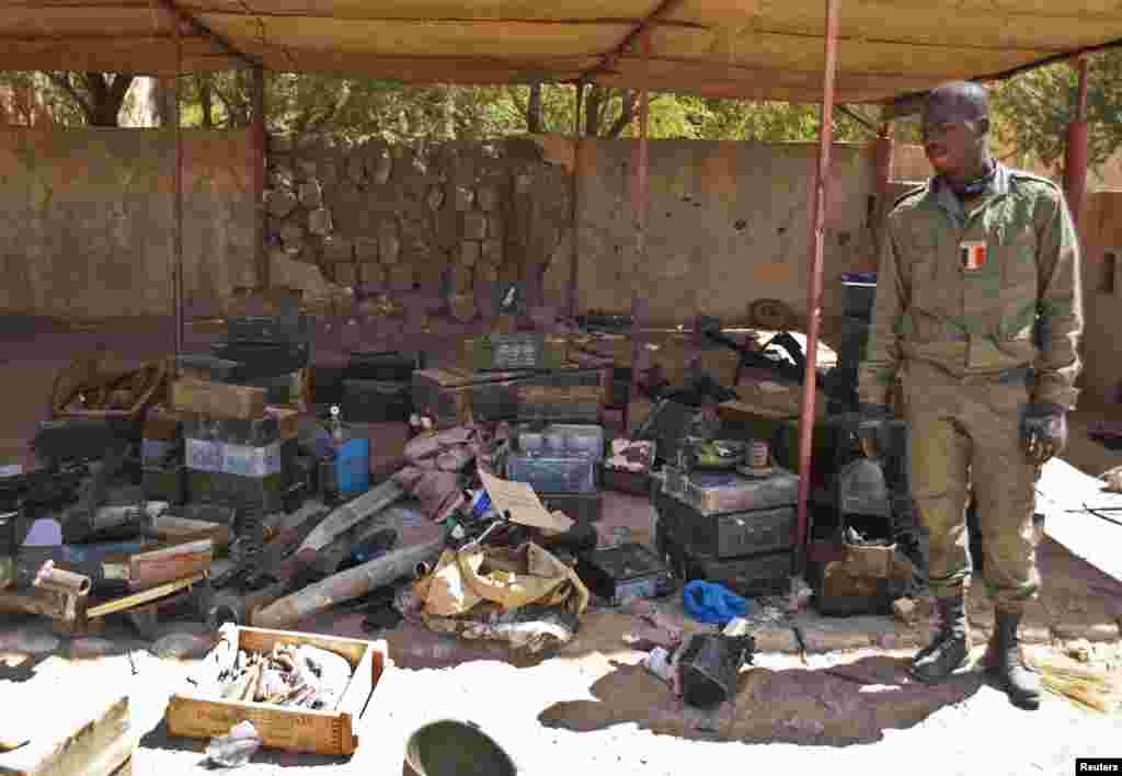 A Malian soldier displays ammunition seized from Islamist rebels after their departure from Timbuktu, Mali, January 29, 2013. 