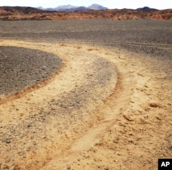 This January 2019 photo provided by the U.S. National Park Service shows vehicle tracks in an area of Death Valley National Park, Calif., that park staff say can leave a lasting trench. National parks across the United States are scrambling to clean up and repair damage caused by visitors and storms during the government shutdown.