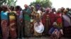 FILE - Women stand in line for food aid in the village of Makunzi Wali, Central African Republic.