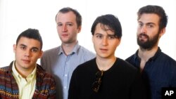 This March 14, 2013 photo shows members of the band Vampire Weekend, from left, Rostam Batmanglij, Chris Baio, Ezra Koenig, and Chris Thomson posing during the SXSW Music Festival in Austin, Texas.