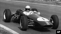 FILE - Australian racing driver Jack Brabham competes at Oulton Park, in Cheshire, England, April 3, 1965.
