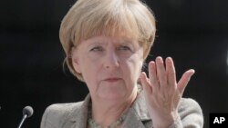FILE - German Chancellor Angela Merkel's Christian Democratic Union considers the Alternative for Germany (AdF) party a far-right fringe group. But the AdF says a regional vote shows otherwise.