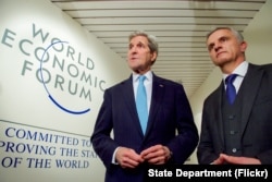 U.S. Secretary of State John Kerry shakes hands with Switzerland Foreign Minister Didier Burkhalter, at the World Economic Forum in Davos, Switzerland, Jan 21, 2016.