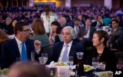 Energy Secretary Ernest Moniz, center, sits with other guests at the SelectUSA investment summit in Washington, June 20, 2016.