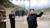 FILE - North Korean leader Kim Jong Un (R) gives field guidance during a visit to the construction site of the Paektusan Hero Youth Power Station near completion in this undated photo released by North Korea's Korean Central News Agency (KCNA) in Pyongyang.