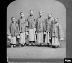 Six boys from the first detachment in 1872, shortly after arriving in San Francisco. From left to right: Chung Mun Yew, Liang Tun Yen, unidentified, Sze Kin Yung, unidentified, New Shan Chow. (Public domain photo)