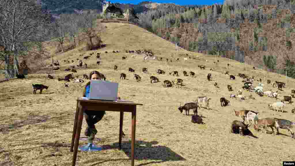 10-year-old Fiammetta attends her online lessons in the mountains as schools are closed due to COVID-19 restrictions in Caldes, northern Italy. (Val di Sole press office/ Handout)