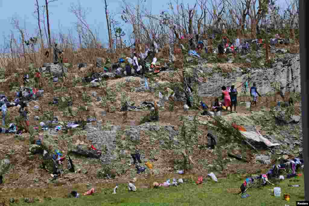 Displaced Haitian nationals take refuge on the grounds of the Government complex in the aftermath of Hurricane Dorian on the Great Abaco island town of Marsh Harbour, Bahamas, Sept. 4, 2019.