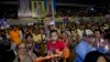 A child plays a toy guitar during a rally ahead of a general election in Bangkok, March 22, 2019. The nation's first general election since the military seized power in a 2014 coup is scheduled to be held March 24.