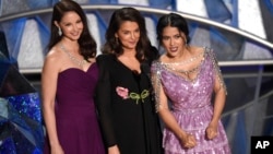 Ashley Judd, from left, Annabella Sciorra and Salma Hayek speak at the Oscars, March 4, 2018.