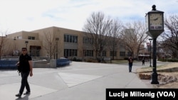 Students walk across the University of New Mexico campus in Albuquerque, New Mexico.