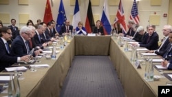FILE - Representatives of world powers meet to pin down a nuclear deal with Iran, on March 30, 2015, in Lausanne, Switzerland. 