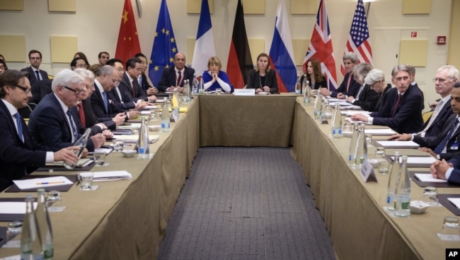 FILE - Representatives of world powers meet to pin down a nuclear deal with Iran, on March 30, 2015, in Lausanne, Switzerland.