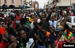 Protesters calling for Zimbabwean President Robert Mugabe to step down take to the streets in Harare, Zimbabwe, Nov. 18, 2017.