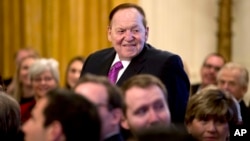 FILE - Las Vegas Sands Corp. Chief Executive and Republican donor Sheldon Adelson stands as he is recognized by President Donald Trump during a Medal of Freedom ceremony in the East Room of the White House in Washington, Nov. 16, 2018.