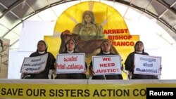 Nuns hold placards during a protest demanding justice after an alleged sexual assault of a nun by a bishop in Kochi, in the southern state of Kerala, India, Sept. 13, 2018.