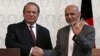 Afghan President Ashraf Ghani (R) shakes hands with Pakistani Prime Minister Nawaz Sharif after a news conference in Kabul, May 12, 2015. 