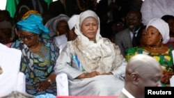 FILE - Gambia new vice president, Fatoumata Jallow Tambajang (center), is seen during President Adama Barrow's swearing-in ceremony and the Gambia's Independence day ceremony at Independence Stadium, in Bakau, Gambia, Feb. 18, 2017. 