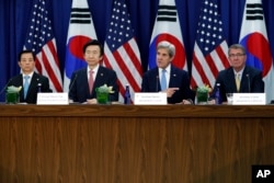 From left, South Korean Defense Minister Han Min-koo, South Korean Foreign Minister Yun Byung-se, and Defense Secretary Ash Carter, right, listen as Secretary of State John Kerry speaks before a meeting at the State Department in Washington, Oct. 19, 2016.