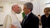 FILE - Pope Francis greets Italian journalist Andrea Tornielli at the Vatican, Jan. 11, 2016.