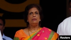 FILE - Former Sri Lankan President Chandrika Kumaratunga, who heads the reconciliation unit of President Maithripala Sirisena's government, says the war crimes court should start work by month's end or in early January.