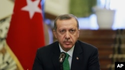 FILE - Turkish Prime Minister Recep Tayyip Erdogan attends a news briefing.