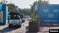 FILE - Peacekeepers serving in the United Nations Organization Stabilization Mission in the Democratic Republic of the Congo (MONUSCO) drive into their compound after patrolling the streets during mass protests against President Joseph Kabila in the capital, Kinshasa, April 10, 2017.