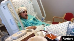 Thirteen-year-old Ahmed Manasra, sits in his hospital bed at Hadassah hospital in Jerusalem in this handout picture released from the Israeli Government Press Office Oct. 15, 2015.
