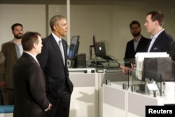 President Barack Obama greets employees on a tour of software development company InDatus in Louisville, Kentucky, where he stopped to highlight his TechHire jobs initiative, April 2, 2015.