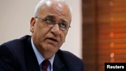 FILE - Palestinian chief negotiator Saeb Erekat speaks during an interview with Reuters in Ramallah, Aug. 11, 2013. 