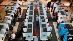 FILE - People vote in Henderson, Nevada, in midterm elections, Nov. 6, 2018.