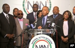 The Rev. Al Sharpton, center, speaks to the media at the National Action Center in New York, Sept. 21, 2016 about the shooting death of Terence Crutcher in Tulsa, Oklahoma, on Sept. 16, 2016.