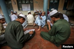 Pakistani religious students attend a lesson at Darul Uloom Haqqania, an Islamic seminary in Akora Khattak, Khyber Pakhtunkhwa province, Sept. 14, 2013.