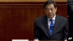 In this March 13, 2012 photo, former Chongqing Communist Party Secretary Bo Xilai attends the closing session of the Chinese People's Political Consultative Conference held in Beijing's Great Hall of the People, China. The new leadership in the southweste