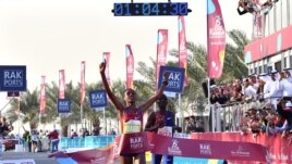 Ababel Yeshaneh crosses the finish line of RAK Half Marathon and breaks the half marathon world record on February 21, 2020 in United Arab emirate of Ras Al Khaimah. (Photo by GIUSEPPE CACACE / AFP)
