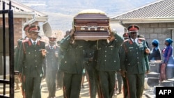 The coffin of Lesotho's Army Lieutenant General Khoantle Motsomotso is carried at his funeral in Malibamatso, Sept. 14, 2017. 