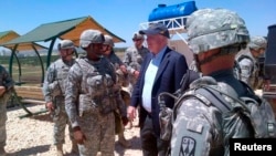 Senator John McCain is pictured with U.S. troops at a Patriot missile site in southern Turkey, May 27, 2013 in this picture released via McCain's Twitter account. 
