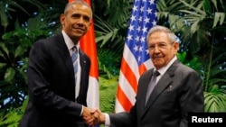 U.S. President Barack Obama and Cuba's President Raul Castro shake hands during Obama's visit to Cuba, in Havana, March 21, 2016.