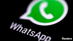 FILE - The WhatsApp messaging application is seen on a phone screen Aug. 3, 2017.