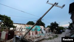 Buildings destroyed by an earthquake that struck off the southern coast of Mexico late on Thursday are seen on a street in Juchitan, Mexico, Sept. 8, 2017.